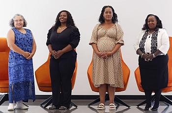 Four women standing 