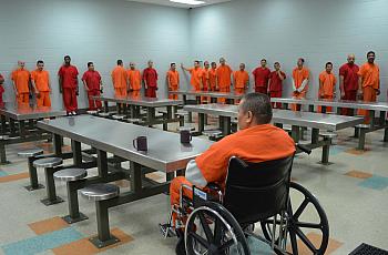 Prisoners standing in line at the dining area