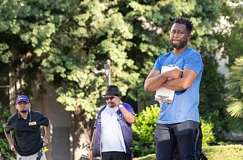 A man with others in the background