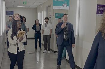 Journalists tour a medical facility in LA.