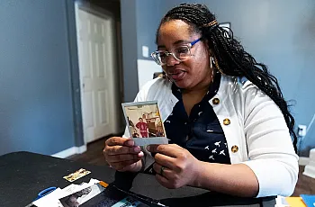 Person looking at a photograph