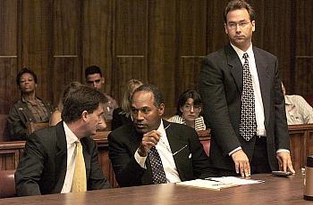 OJ Simpson, flanked by lawyers.