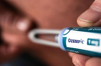 Ozempic shown being administered.