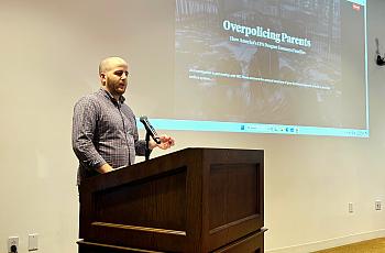 Eli Hager speaks at a podium.