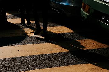 Person walking in dark alley