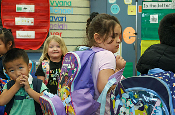 Children waiting to be picked up at a school