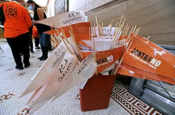 Orange and white banners of domestic columns in a bucket