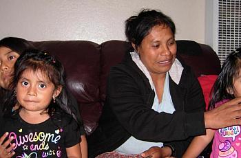 Natividad with daughter and girls from other families who live in her home