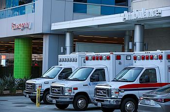 Ambulances parked by the emergency section of a hospital