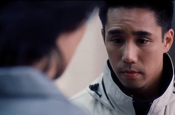 A tight shot from the film Better Luck Next Time shows two Korean high school students talking