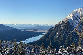 A view of a valley with a river body