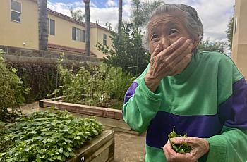 a woman with her hand to her mouth