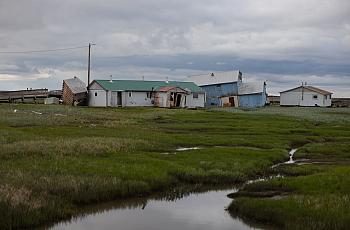 Buildings shorn off their foundations in Kwigillingok, Alaska