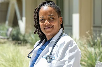 A women wearing white coat
