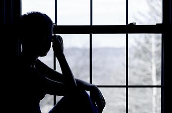 A person sitting by the window 