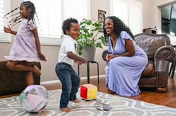 Person and children playing