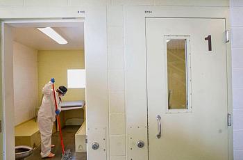 An inmate cleans a jail cell at the Las Colinas Women’s Detention Facility in Santee, California, in April 2020.