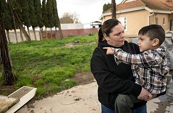 A person and a child in arms