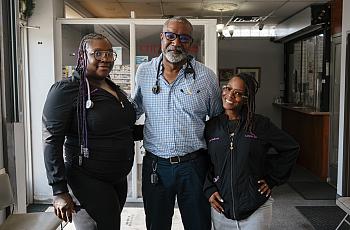 Three people standing together