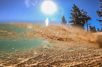 Water laps at the lake Tahoe's beach shore