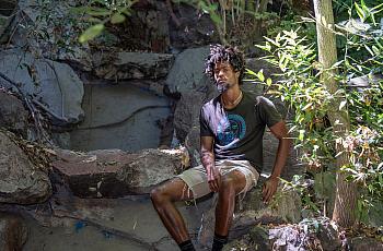 Person sitting on rocks