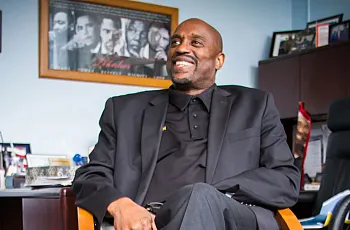 A person in a black suit