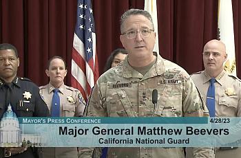 Army General speaking at Mayor's press conference