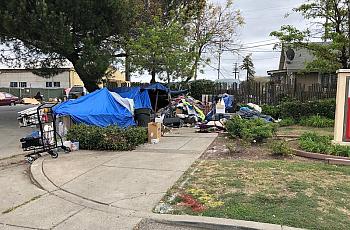 Image of huts on side of road