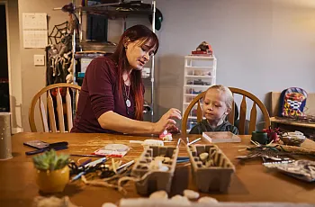A person and a child at a table