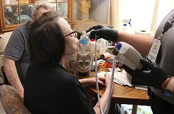 Paramedic taking temperature