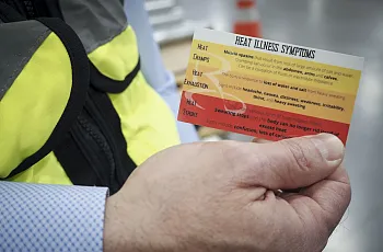 A person holding a card