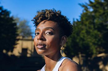 Shamari White, 26, poses for portraits at Meridian Hill/ Malcolm X park in Washington, D.C., on March 5, 2023. White experienced suicidal ideation and self-harm due to bullying and sexualization in middle school. (Maen Hammad/Word In Black)