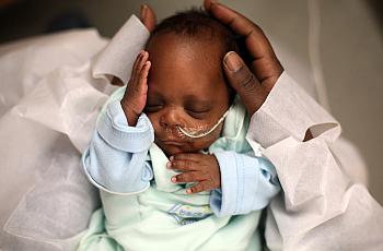 A baby recovers in the neonatal intensive care unit of an Indiana hospital in 2014. The state is among those that recently passe