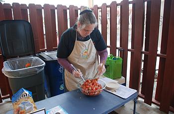 Rose Brown makes pico de gallo at Pacific Pantry's one-year anniversary celebration in May.