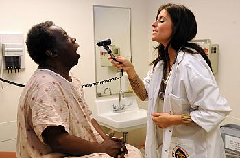 A nurse practitioner sees a patient.