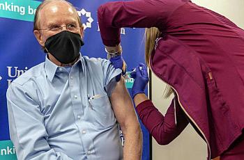 Bexar County Judge Nelson Wolff receives his COVID-19 vaccination Wednesday, Dec. 30, 2020 at University Hospital from medical a