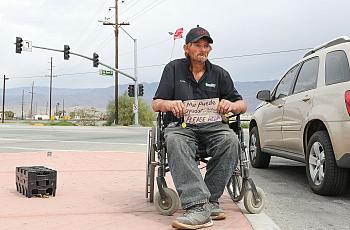 Robert Hensley panhandles for enough money to buy some heroin which treats his pain and his addiction in Indio, April 8, 2019. 