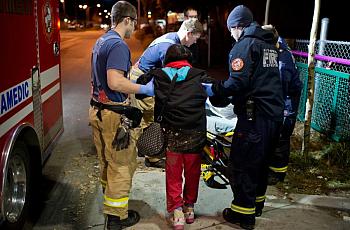 Anchorage Firefighters assist a woman near 13th Avenue and Hyder Street. The intoxicated woman complained of heart rhythm irregularities and was transported to a hospital. Medic Matt Eckart said the demands on the fire department by intoxicated people can wear down firefighters. “We take them to the hospital, they release them, they go to Anchorage Safety Patrol and they just sober up to get out and go do this - drinking - again. It’s just a big cycle,” he said.