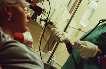 Medical professional cares for patient. Hospital comparisons can be hard to make. Learn why this website is a good place to start. 