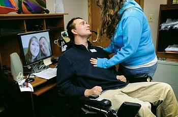 Michael Woods lost motor function in all of his limbs following a 2007 suicide attempt. He now travels to schools to speak on suicide prevention. He and his fiancee, Ashley Mead, spend a tender moment in his Billings office where he helps people with disabilities live independently. The couple plans to marry in June 2014.  