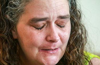 Tears flow as Adria Trader talks about how she lost her kids to the child welfare system.