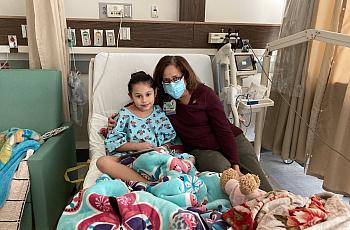 Brianna, 8, with author Dr. ChrisAnna Mink, during her January stay at Harbor-UCLA Medical Center, where she was treated for a C