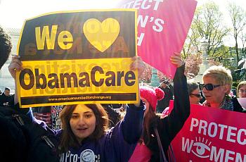Women rally in favor of the ACA