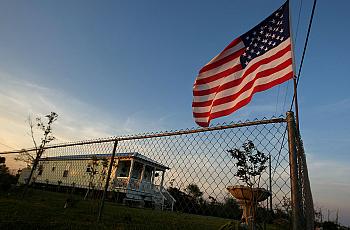 An American flag flies above a post-Katrina trailer in Waveland, Mississippi. 