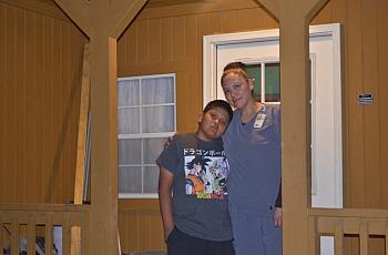 Chelsea and Ethan Holtsoi in front of their cabin near Many Farms on the Navajo Reservation.
