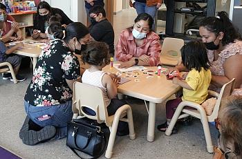 Parents and children take part in a toddler socialization gathering at the  Children’s Institute. 