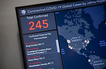 Outbreak map dashboard being used by officials to track the virus. (Photo by Samuel Corum/Getty Images)