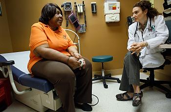 woman speaking with doctor