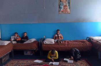 Children shown in an orphanage. (Photo by Wakil Kohsar/AFP via Getty Images)   