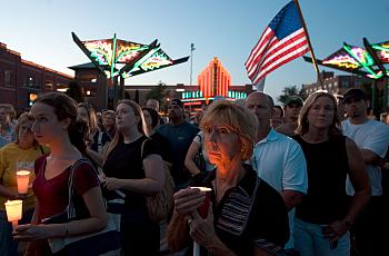 Dea Deujsch (C) participates in a candle light vigil for Dr. George Tiller in Old Town May 31, 2009 in Wichita, Kansas. Dr. Geor